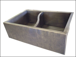 award winning nickel silver farmhouse sink with s curve divider creating the double basin and a hammered nickel silver hammered apron front