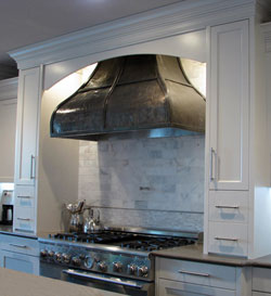 custom range hood, hammered nickel silver with medium finish and smooth strapping custom range hood, hammered nickel silver with medium finish and smooth strapping