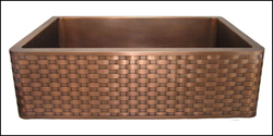 copper farmhouse sink with a basket weave apron front