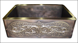 dark bronze farmhouse sink with decorative repoussé apron front