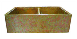 copper double basin farmhouse sink with a verdigris finish