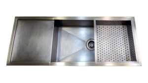 Custom Brass sink with integrated drain board and vegetable colander; dark brass