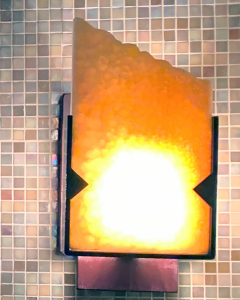 AWS natural onyx slab and copper wall sconce